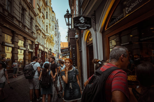 a group of people walking down a street