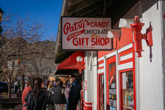 Patsy's candy and gift shop storefront with people outside