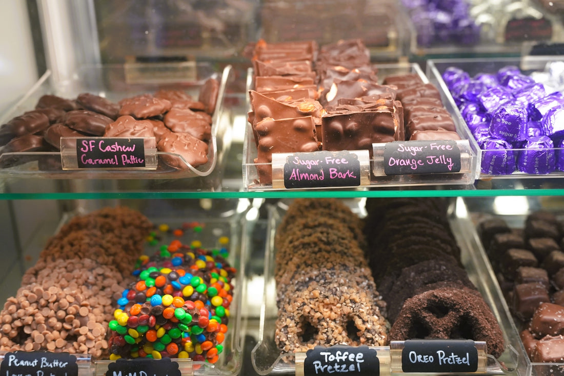 Assortment of chocolates and cookies in a display case