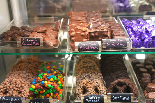Assortment of chocolates and cookies in a display case