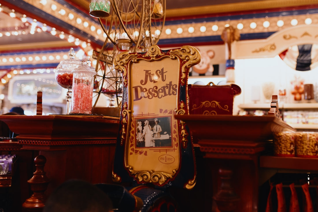 A hot desserts sign in a brightly lit, ornate shop.