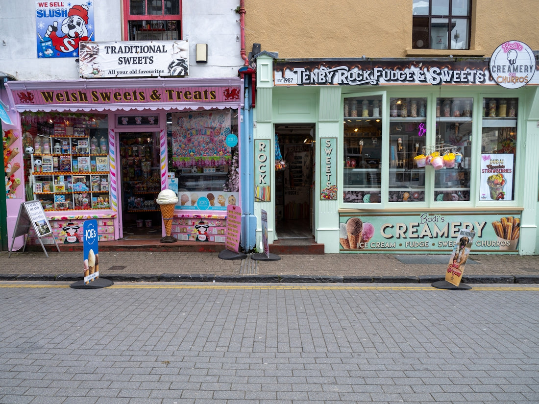 Two colorful sweet shops and ice cream parlors.